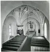 Badelunda sn, kyrkan.
Interiör med predikstol m.m., 1983.