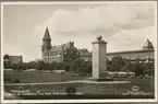 Trelleborg, tyska Röda Korsets monument med stationen i bakgrunden.