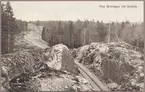 Skärning genom skogsområde och berg i närheten av Krokek.