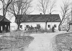 Någon gång under 1870-talets första hälft förevigade den danskättade fotografen Peder Anton Eriksén denna vy mot Ekebyborna kyrkoherdeboställe. Vackert belägen på en udde vid sjön Boren. Ursprungligen uppförd 1735 och länge ansedd som en av de 