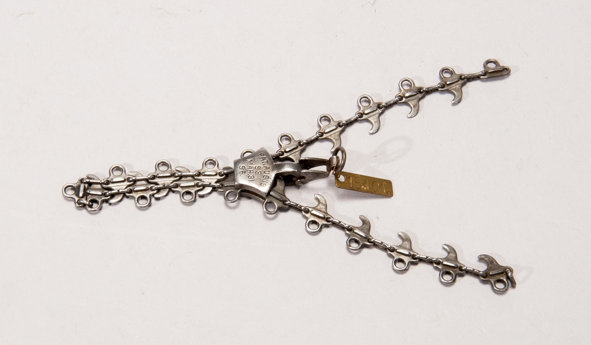 Unikt exemplar av blixtlås, "fastening for shoes". Märkt: Pat. Aug. 19.93 Mar.31. 96".