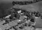 Flygfoto över Norra Sandsjö kyrka i Nässjö kommun, Jönköpings län. Nr: 425/1957