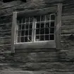 Spröjsat fönster på torpet Sandliden.