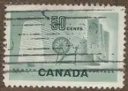 Frimärke ur Gösta Bodmans filatelistiska motivsamling, påbörjad 1950.
Frimärke från Canada, 1953. Motiv av spinnrock: symbol för gamla tiden. Vävspole och tyg: symboler för modern textilindustri.