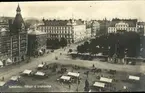 Vykort med motiv över Stora torget och Storgatan i Sundsvall.