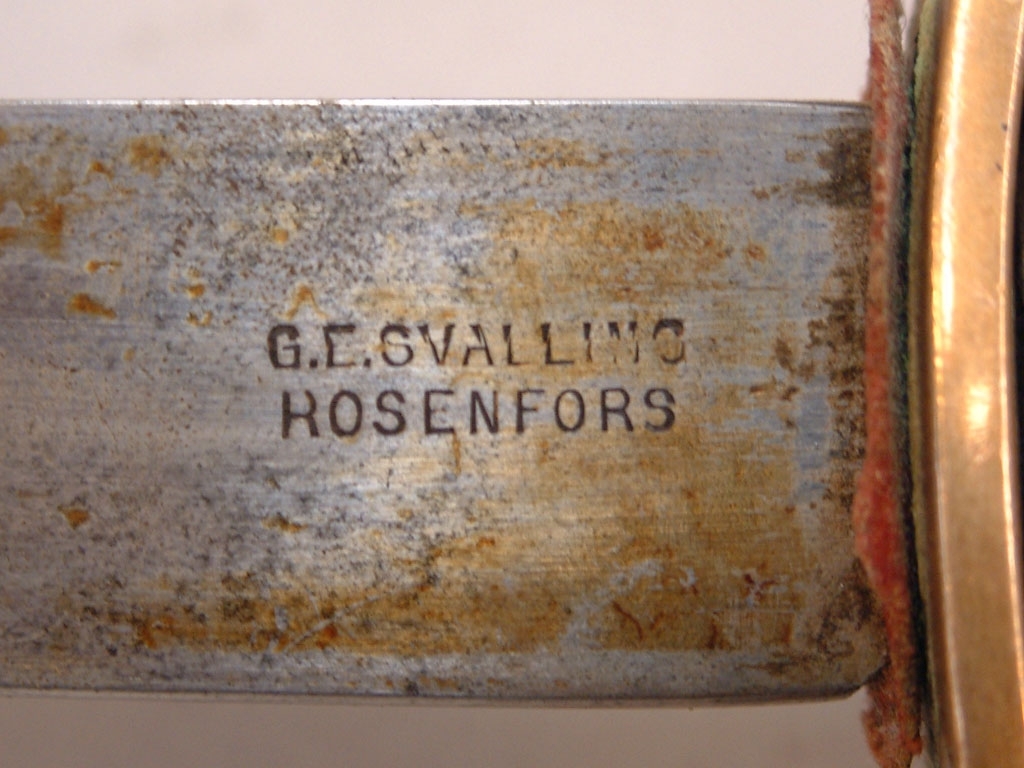 Sabel för järnvägspolisen på Gefle Dala Jernväg.
På sabelns handtag finns ett monogram (se bild).