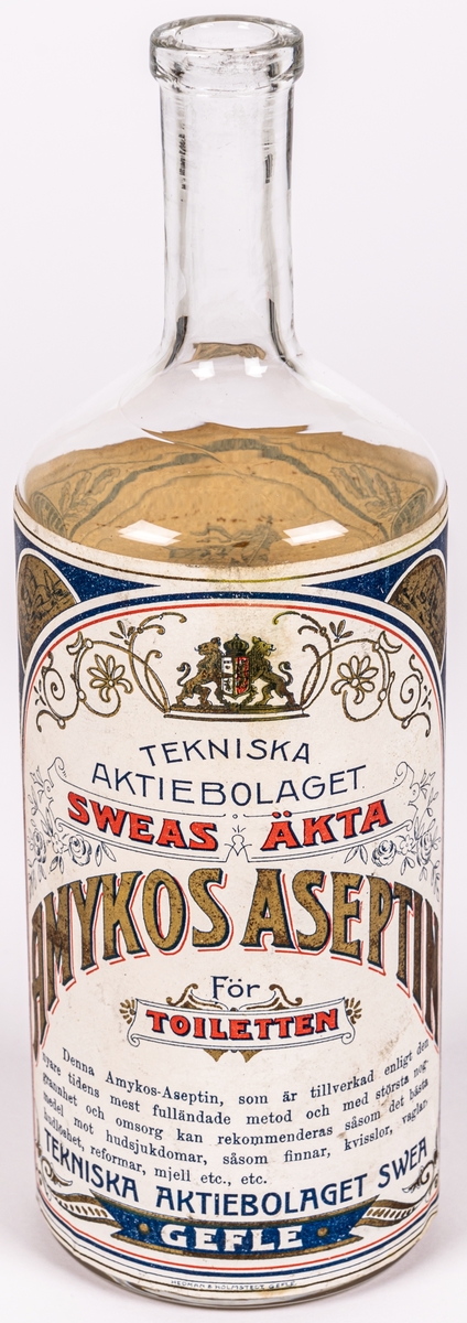 Glasflaska. 
Etikett med text; 
Tekniska aktiebolaget
Sweas Äkta
Amyktos-Aseptin. 
För toiletten.