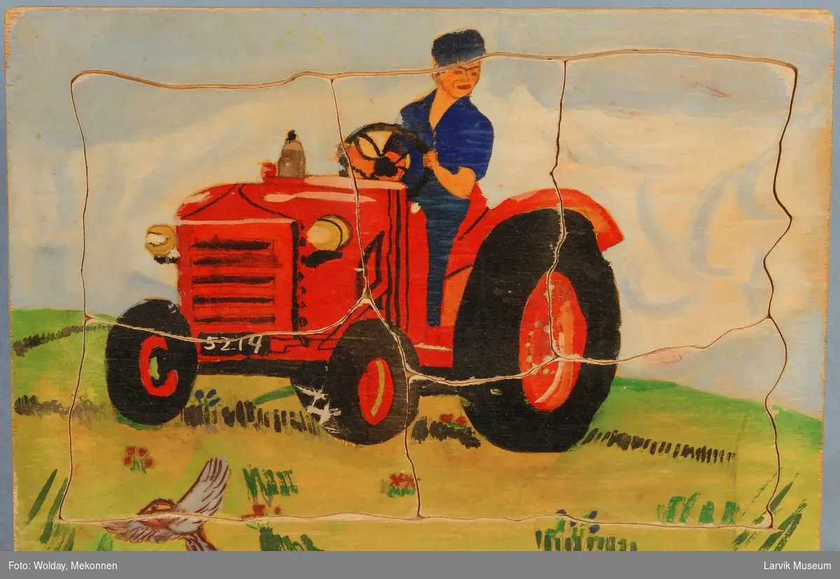 Mann på traktor.