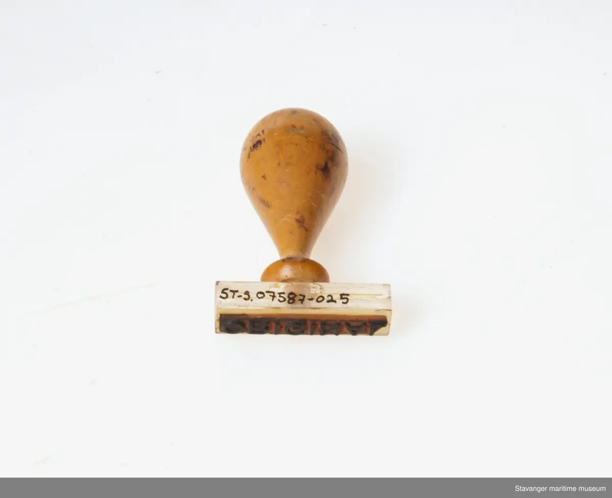 Stempel med trehåndtaket, hvor det står: Original