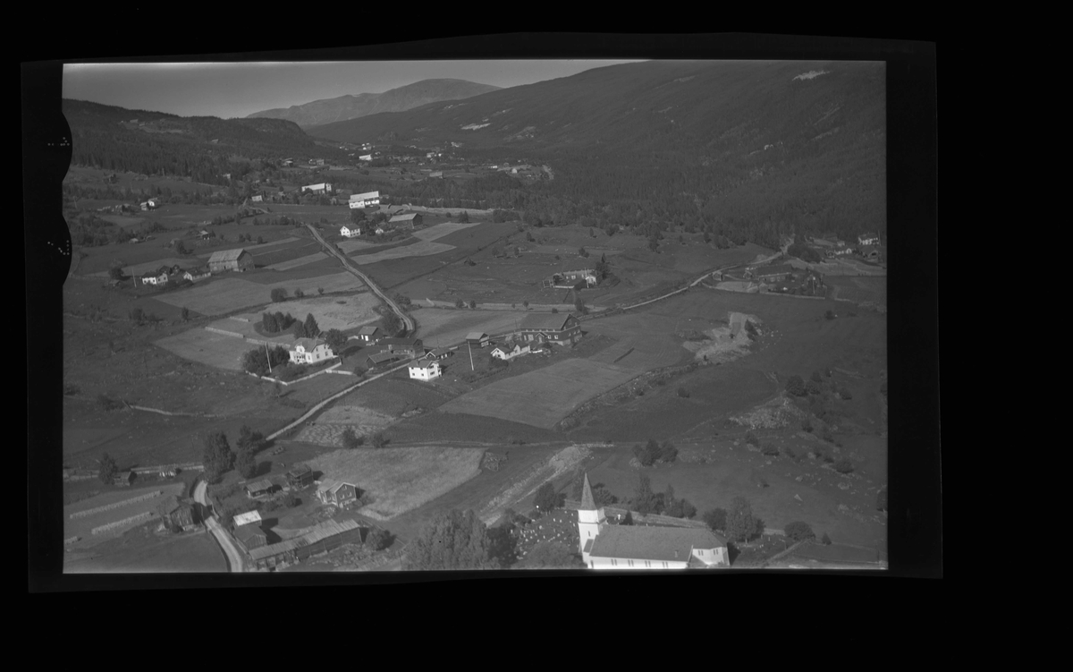 Flyfoto av Golreppen mot Øygardane. 
Gol Kyrkje, Prestegarden, Storla.
Kyrkje, låve, bolighus.