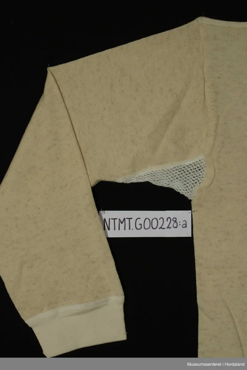 Lange ermer med brotavslutning, rund hals