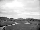 Landskapsvy med Enköpingsån vid Ullunda. Tillinge socken, Uppland, april 1919