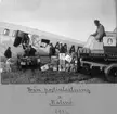 Lastning av paket i en Junkers flygmaskin vid Malmö flygfält, 1936.