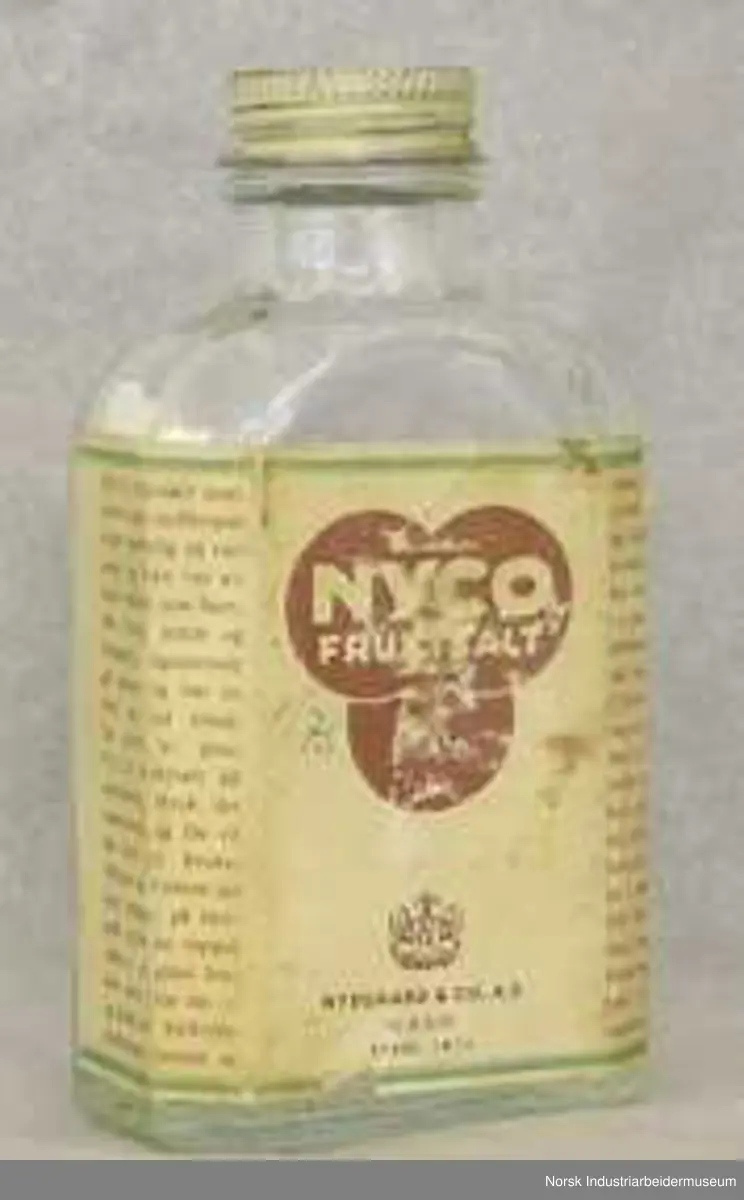Glassflaske Nyco fruktsalt med skrukork i metall.