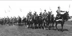 Musikkåren K 3, Skövde, vid prins Gustaf Adolfs och prinsessan Sibyllas besök 1935. Prinsens häst bröt nacken vid prishoppningstävlingarna.