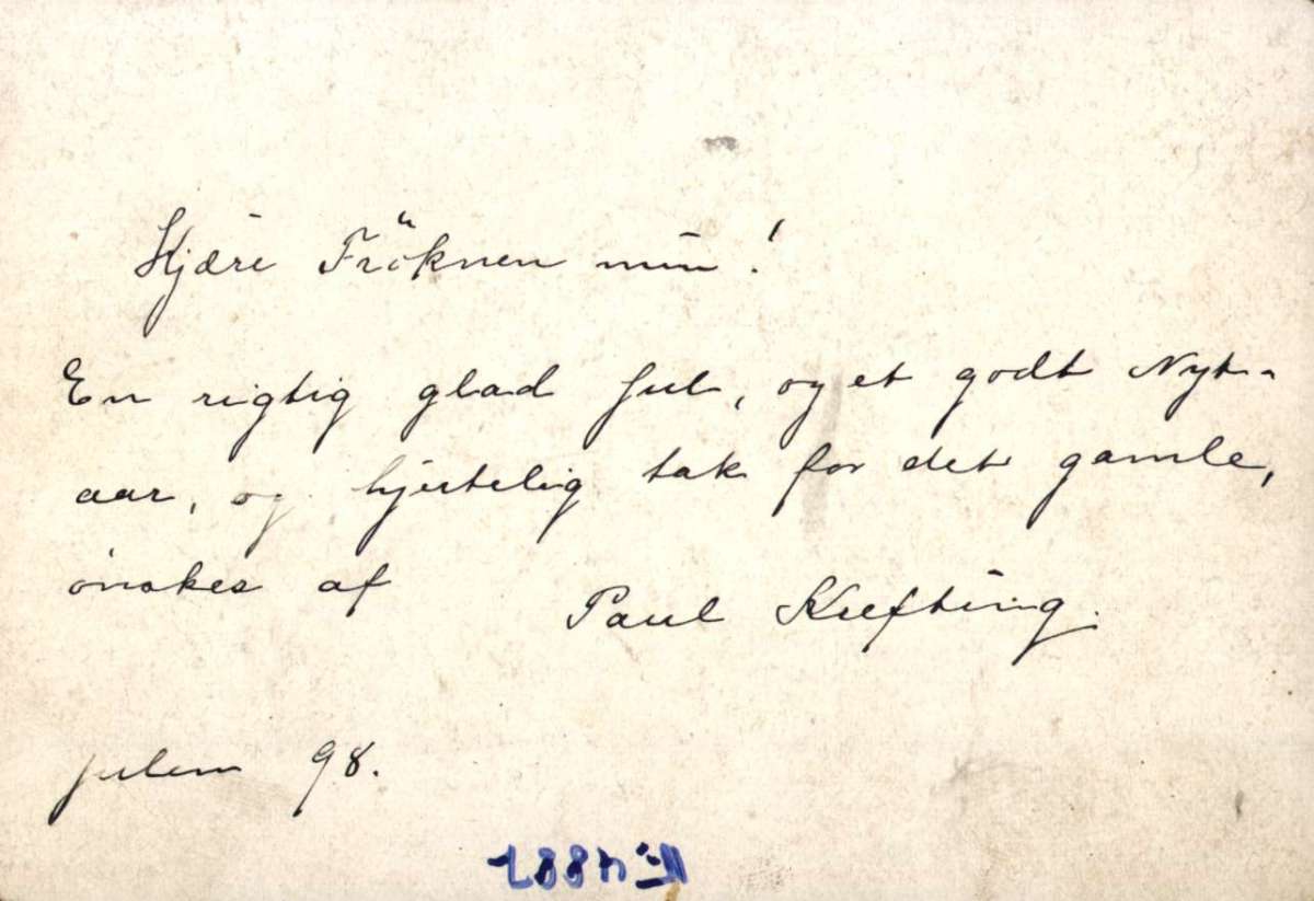 Postkort. Jule- og nyttårshilsen. Dyremotiv. Tre glade griser danser utenfor grisebingen. Datert julen 1898.