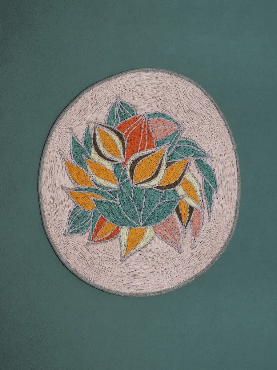 Broderi av blomster i en sirkel