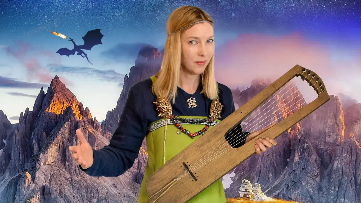 Kvinne i grønn vikingkjole med harpe. Drage i bakgrunnen