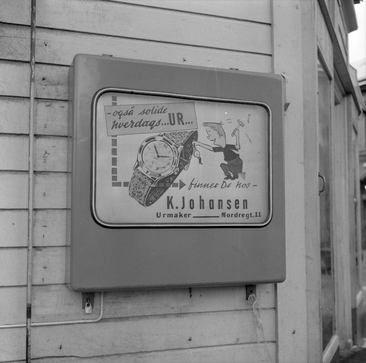 Reklamefoto for Scandia. Div reklameskilt i byen