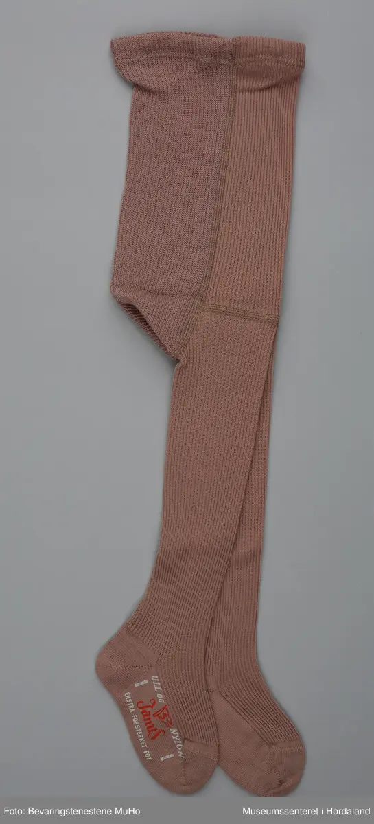 Gammalrosa barnestrømpebukse i ull og nylon, i merket Janus.