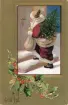 Brevkort adresserat till sjuksköterskan Amanda Palm.
Julkortsmotiv av tomten som är på väg in i någons hem bärandes på en julgran. Text på framsidan: 
