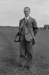 Porträtt av man i kostym, 1950-tal