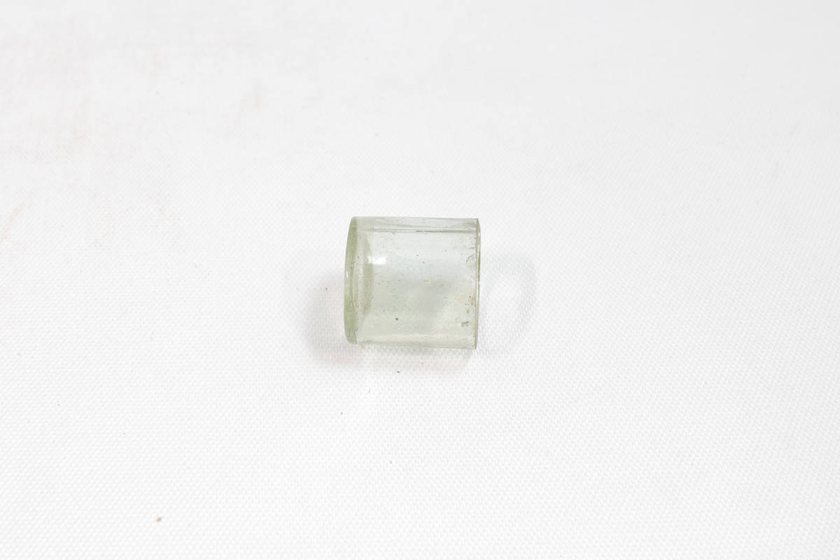 Liten krukke av glass.