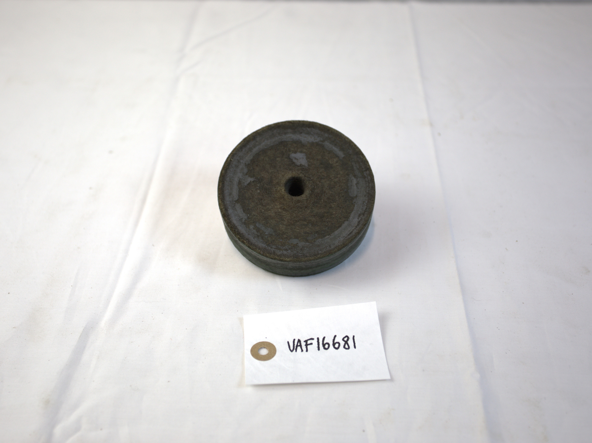 Sirkelformet polerstikkel brukt til polering i gullsmedvirksomhet. 