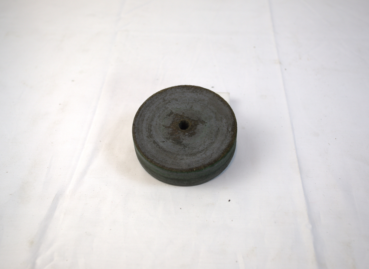 Sirkelformet polerstikkel brukt til polering i gullsmedvirksomhet. 