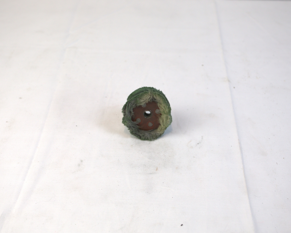 Polerstikkel med myk børstekant brukt i gullsmedvirksomhet.