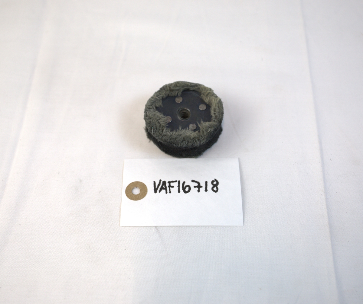 Polerstikkel brukt som verktøy i gullsmedvirksomhet. Stikkelen har lær og metall.