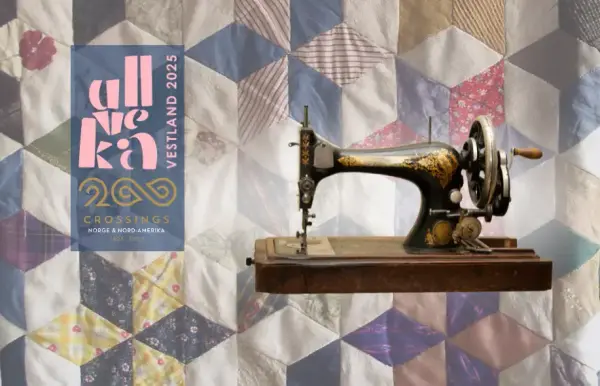 Gammel sveivsymaskin og fargerikt quilteteppe