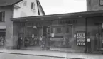 Storgatan (kv. Fries) med dåv. Helmer Nilssons bokhandel. Till vänster ser man Askelyckans fastighet (innan renovering).