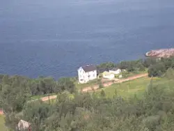 Flyfoto over Sørreisa kommune i 1961. Gården "Bergtun" ved G