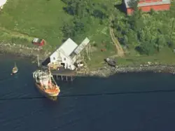 Flyfoto over Sørreisa kommune i 1961. Ved gården Bergstad. B