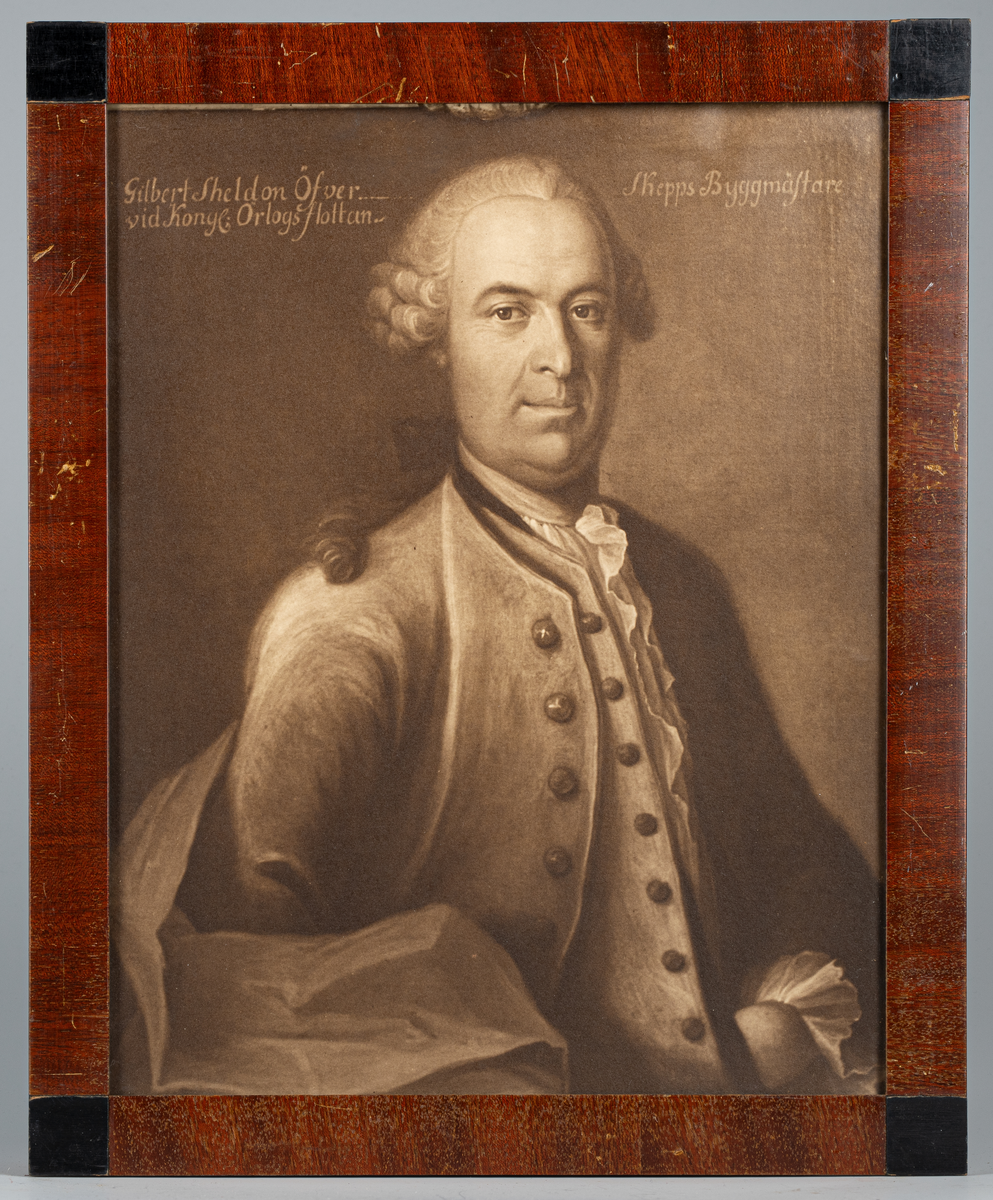 Fotografi av porträtt av överskeppsbyggmästaren Gilbert Sheldon, inramad i brun ram.