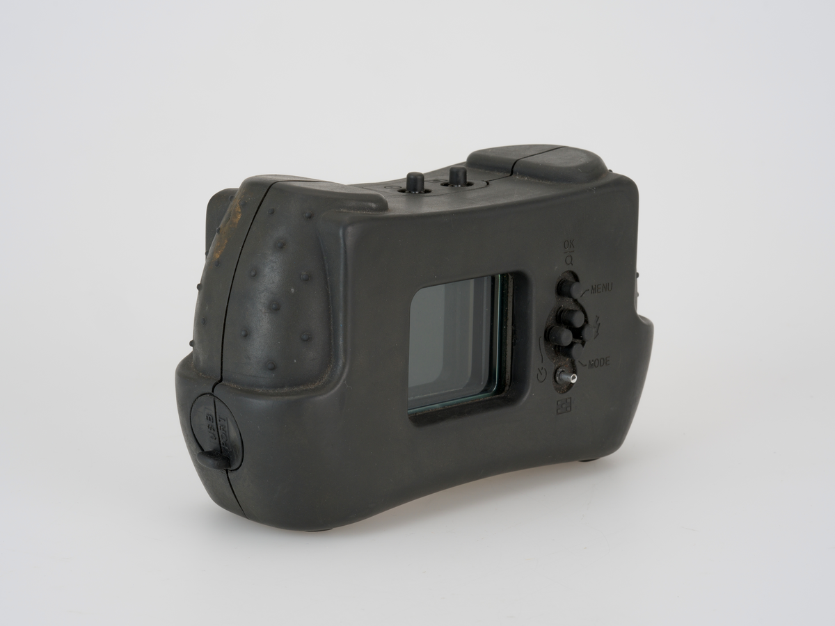 Digitalt kamera som er konstruert for å fungere i miljøer med brannfarlige gasser, blant annet med en kapsling av plastmateriale.