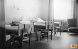 En vårdsal för mödrar.
Väggarmaturerna på bilden är producer