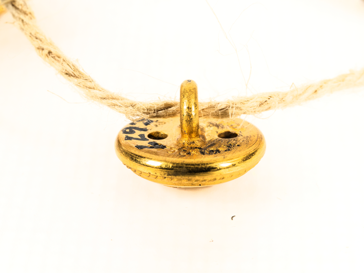 Uniformsknapp från Stockholms Rederi AB Svea.