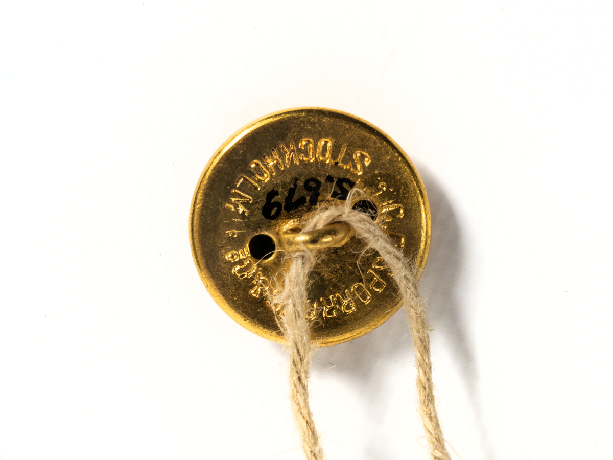 Uniformsknapp från Stockholms Rederi AB Svea.