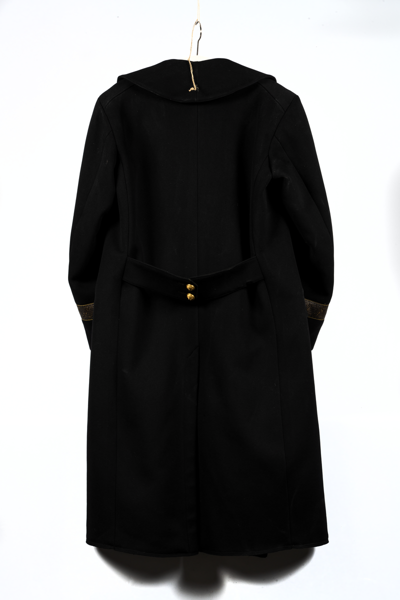 Kappa ändringsmodell M/78 för sjöofficer. Kappan är försedd med gradbeteckning för viceamiral.