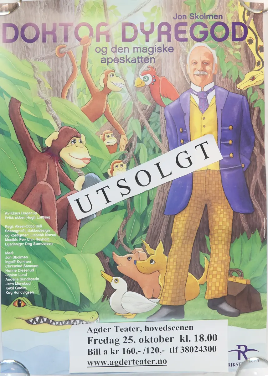 PLakat for oppsetning av "Doktor Dyregod og den magiske apeskatten". Spilt ved Agder teater i 2002. På forsiden av plakaten er det klistret på en lapp hvor det står "UTSOLGT".