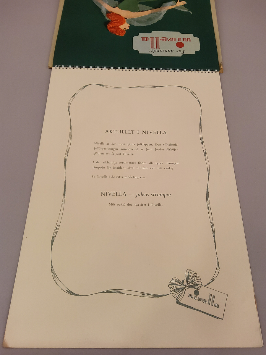 Reklam, almanack-tavla för reklam av Nivella barnstrumpor.
