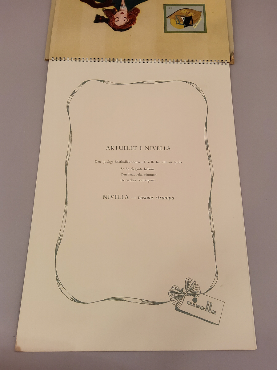 Reklam, almanack-tavla för reklam av Nivella barnstrumpor.