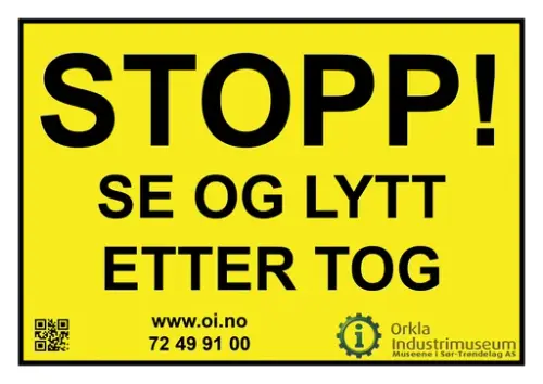 Plakat som sier stopp se og lytt etter tog