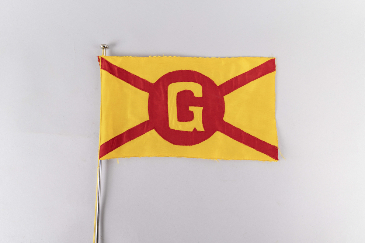 Motiv av skorsteinsmerke til rederiet Odd Godager med bokstaven G