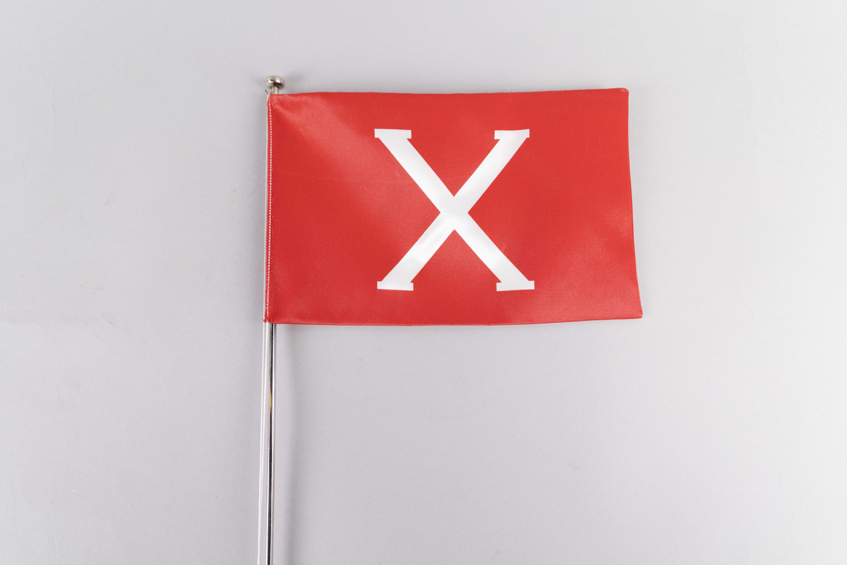 Motiv av skorsteinsmerke til rederiet F. Rasmus Olsen med bokstaven X