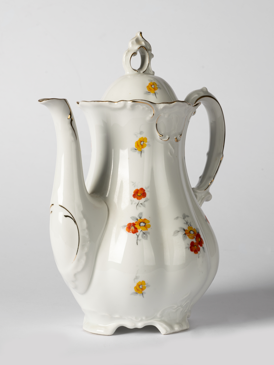 Kaffekanna av porslin med löst lock. Blommig.