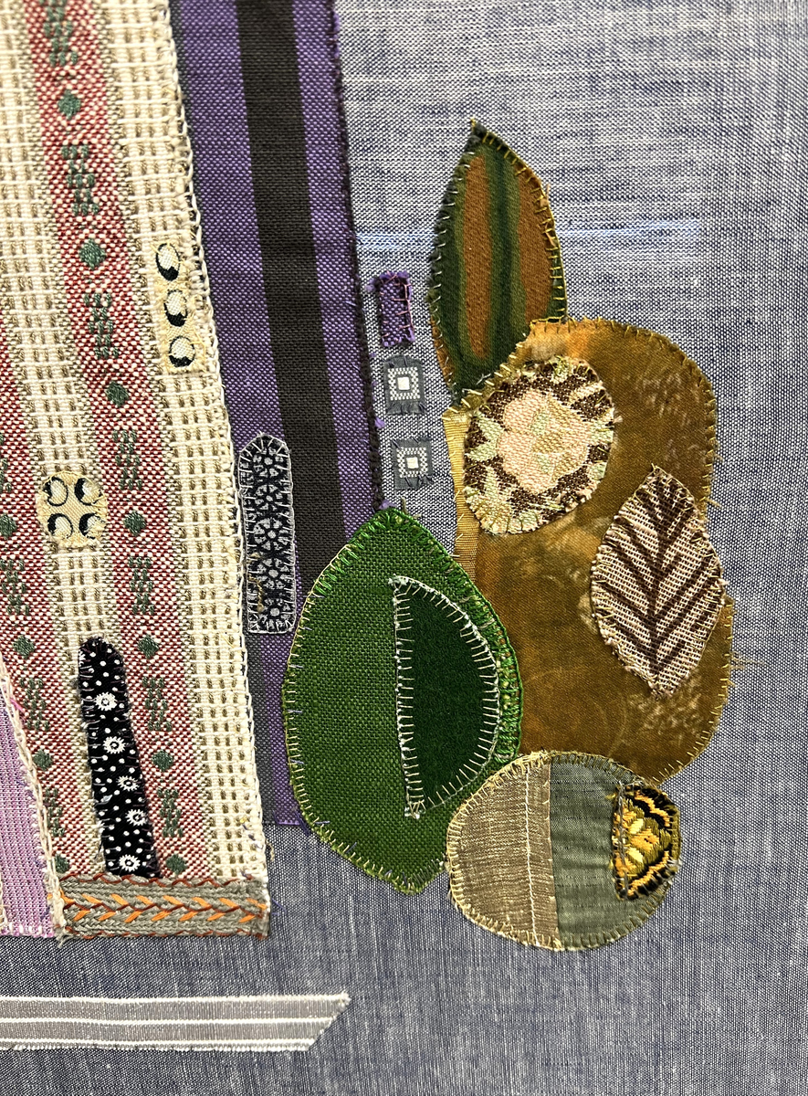 Tavla i textil med motivet Uppsala Domkyrka