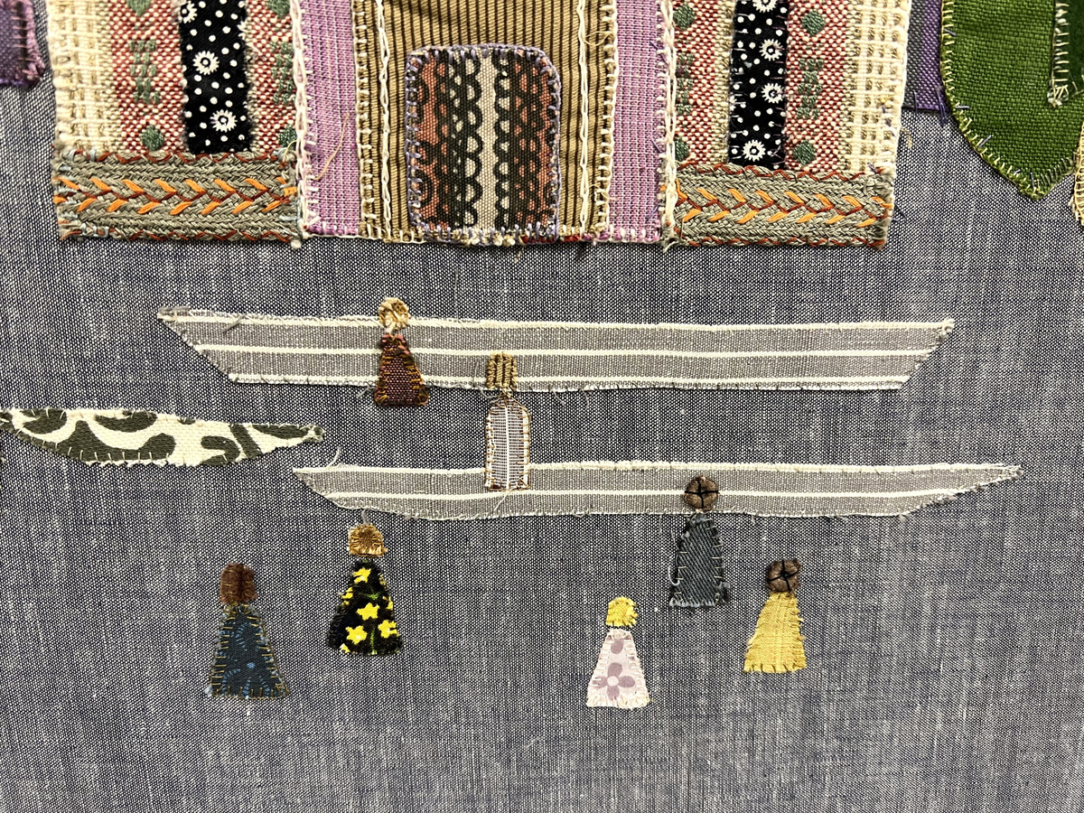 Tavla i textil med motivet Uppsala Domkyrka